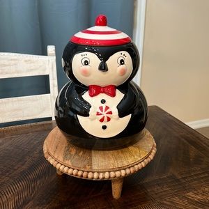 Johanna Parker penguin decor holding peppermint
